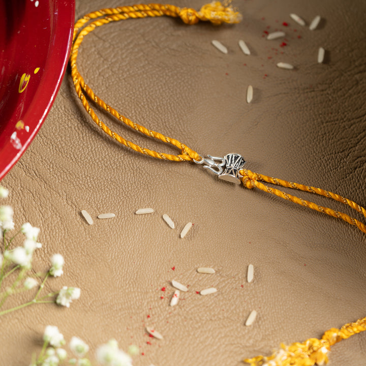 925 Sterling Silver Trishul Damru Rakhi for Brother | Yellow Thread Rakhi with Mahadev Symbol