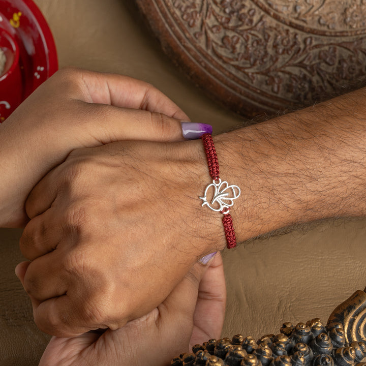 925 Sterling Silver Ganesha Rakhi for Brother | Sunray Inspired Divine Design on Maroon Thread